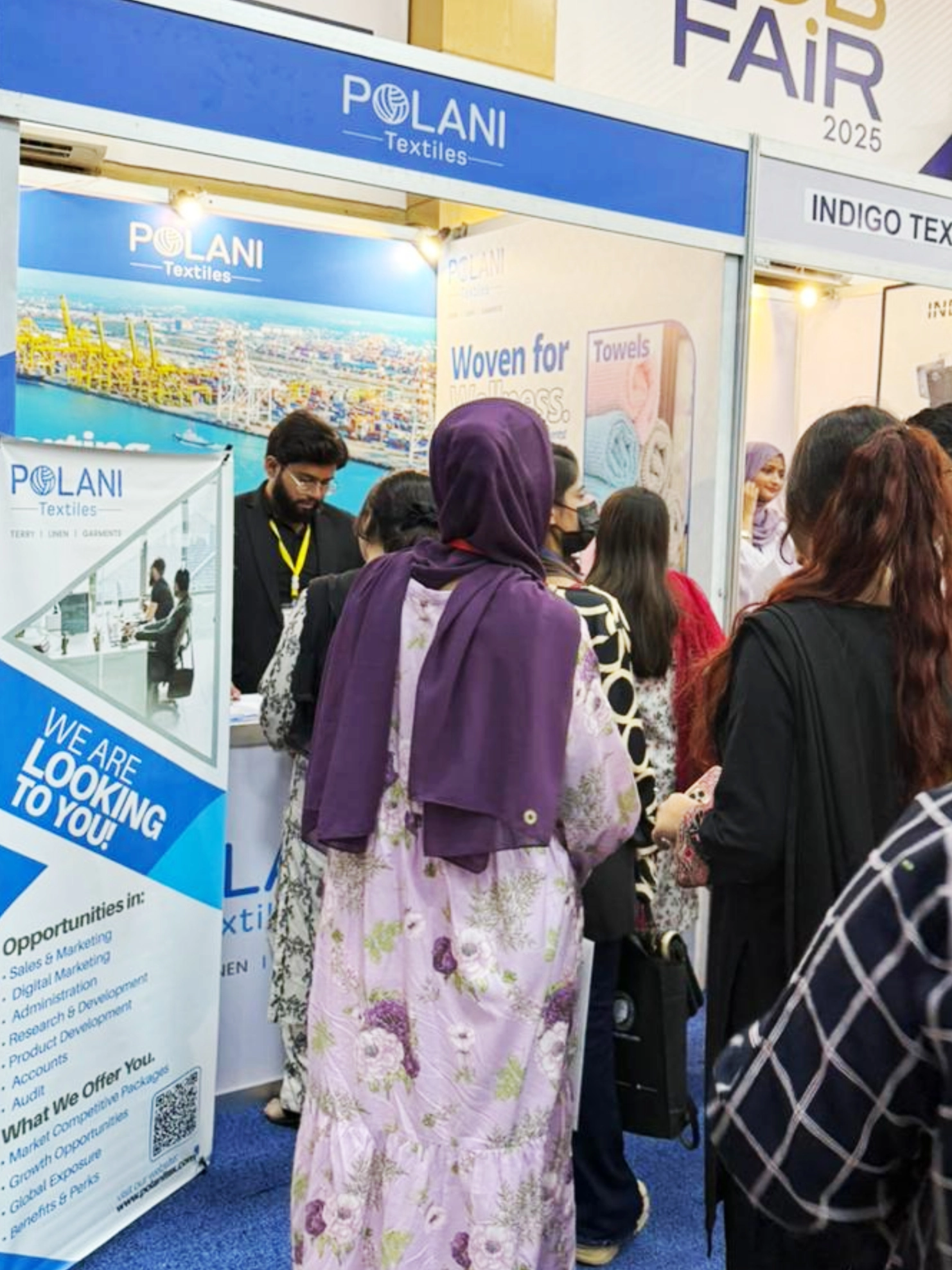 Attendees at rade fair booth.